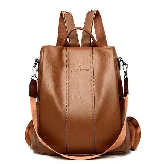  A stylish women's backpack with a sleek design, featuring a sturdy handle, adjustable shoulder straps, and side hooks for versatile carrying options. The bag has a smooth finish and a spacious main compartment, ideal for everyday use or travel.