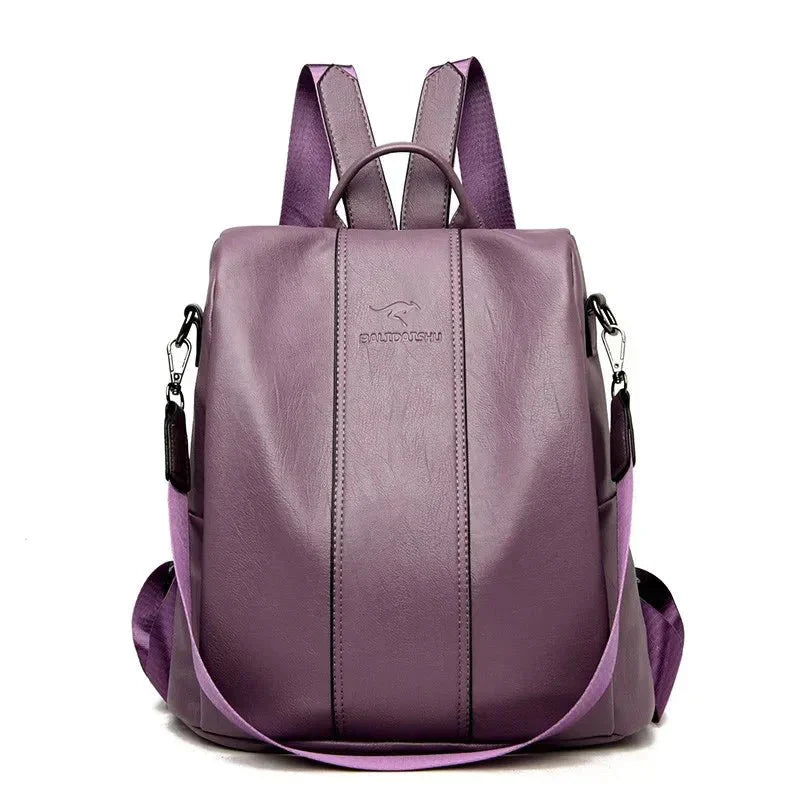  A stylish women's backpack with a sleek design, featuring a sturdy handle, adjustable shoulder straps, and side hooks for versatile carrying options. The bag has a smooth finish and a spacious main compartment, ideal for everyday use or travel.