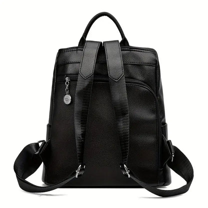  A stylish women's backpack with a sleek design, featuring a sturdy handle, adjustable shoulder straps, and side hooks for versatile carrying options. The bag has a smooth finish and a spacious main compartment, ideal for everyday use or travel.