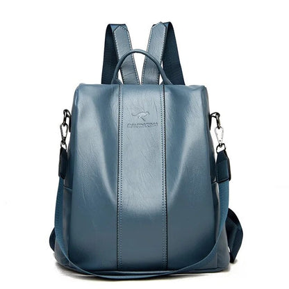  A stylish women's backpack with a sleek design, featuring a sturdy handle, adjustable shoulder straps, and side hooks for versatile carrying options. The bag has a smooth finish and a spacious main compartment, ideal for everyday use or travel.